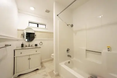 a bathroom with a tub and a sink and a toilet at Spacious 3BR Retreat - Sleeps 10 - Free Parking in Camino