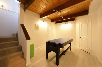 a ping pong table in a room with stairs at Spacious 3BR Retreat - Sleeps 10 - Free Parking in Camino