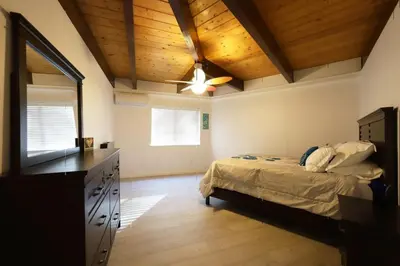 a bedroom with a bed and a wooden ceiling at Spacious 3BR Retreat - Sleeps 10 - Free Parking in Camino