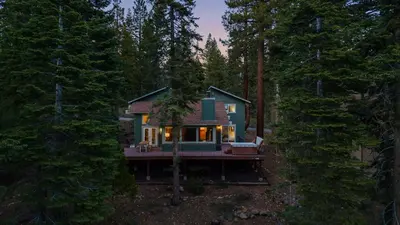 a small house in the middle of a forest at Year-Round Tahoe Escape with Hot Tub Outdoor Dining Timberline Haven by AvantStay in Tahoe Vista