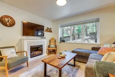 a living room with a couch and a fireplace at Walk to Mammoth Village Chic Mountain Studio in Mammoth Lakes