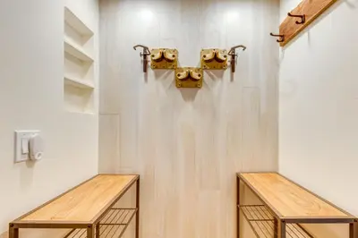 two wooden benches in a room with a wall at Walk to Mammoth Village Chic Mountain Studio in Mammoth Lakes