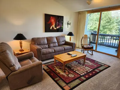 a living room with a couch and a coffee table at Snowcreek Resort Vacation Rental 934 in Mammoth Lakes
