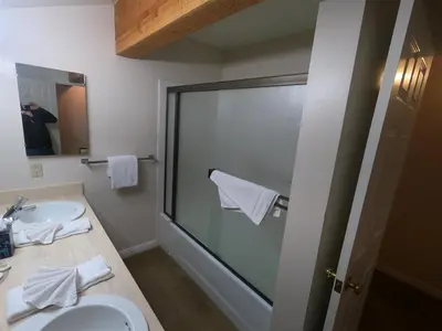 a bathroom with a toilet and a sink and a mirror at Rr-interlaken 09 in June Lake