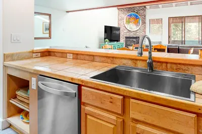 a kitchen with a stainless steel sink and a counter at Moose Roost in Incline Village