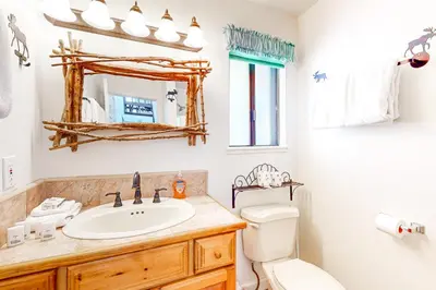 a bathroom with a sink and a toilet and a mirror at Moose Roost in Incline Village