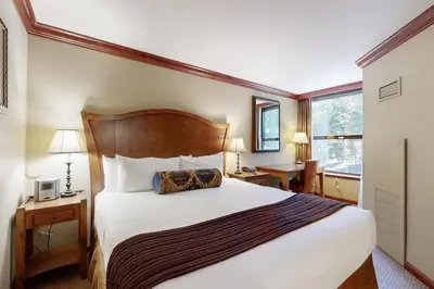 a hotel room with a large bed and a window at Everline Resort & Spa 607B in Olympic Valley