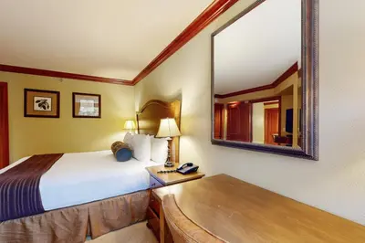 a hotel room with a bed and a mirror at Everline Resort & Spa 607B in Olympic Valley