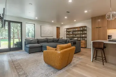 a living room with a couch and a table at The Reserve #126 in Mammoth Lakes