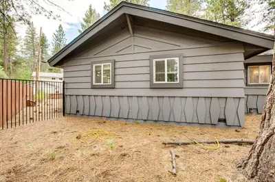 a small house with a window and a fence at Work and Play! Lake Tahoe Cabin 5 Mi to Heavenly Mtn in South Lake Tahoe