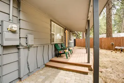 a porch with two green chairs on a house at Work and Play! Lake Tahoe Cabin 5 Mi to Heavenly Mtn in South Lake Tahoe