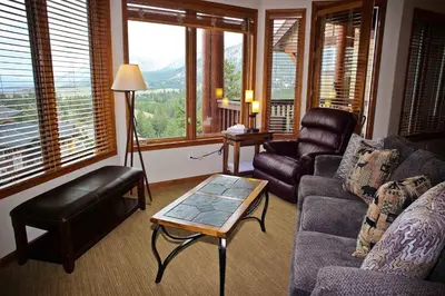 a living room with a couch and a table at Eagle Run # 204 in Mammoth Lakes