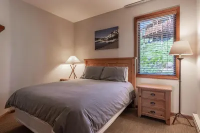 a bedroom with a bed and a window at Eagle Run # 204 in Mammoth Lakes
