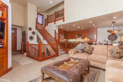 a living room with a couch and a table at Timbers # 1033 in Mammoth Lakes