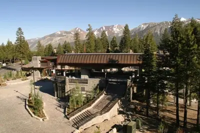 a building with stairs in front of a mountain at Village # 2416 - White Mountain Lodge in Mammoth Lakes