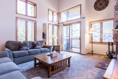 a living room with a couch and a coffee table at Snowcreek #474 in Mammoth Lakes