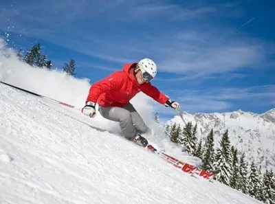 a man is skiing down a snow covered slope at Snowcreek #474 in Mammoth Lakes