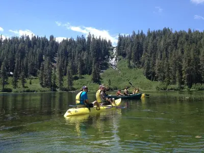 a group of people in kayaks on a lake at Snowcreek #474 in Mammoth Lakes