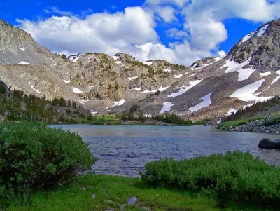 a body of water in front of a mountain at Snowcreek #474 in Mammoth Lakes