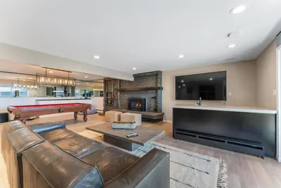 a living room with a couch and a pool table at HCH0868 - The Grand Escape home in South Lake Tahoe