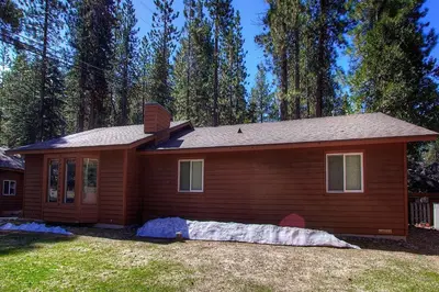 a small house in front of a forest at NVH0823 - Sadies Hustle home in Zephyr Cove