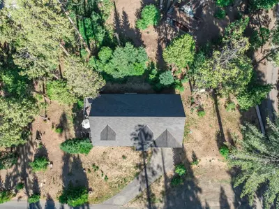 an overhead view of a house with a roof at Leisure Landing Unwind in the Pines in Shaver Lake