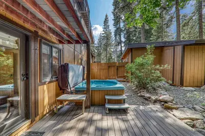 a house with a hot tub on a deck at Retreat with Private Hot Tub steps North Lake Tahoe in Carnelian Bay