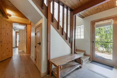 a hallway with a wooden bench in a house at Retreat with Private Hot Tub steps North Lake Tahoe in Carnelian Bay