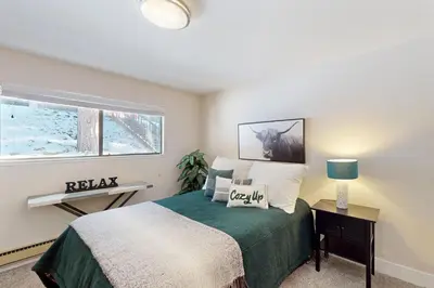 a bedroom with a bed and a window at Brown Bear's Hideaway in Incline Village