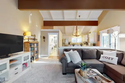 a living room with a couch and a tv at Brown Bear's Hideaway in Incline Village