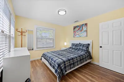 a bedroom with a bed and a window at Cozy Home 7 minutes Walk to UC Davis Sacramento in Sacramento