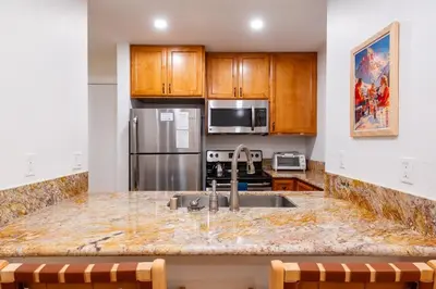a kitchen with a sink and a counter top at Lux Retreat, Covered Parking, Walk to Golf in Mammoth Lakes
