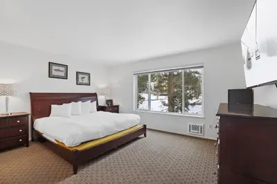 a bedroom with a bed and a window at 3 Bedroom Kirkwood Condo – Base Camp condo in Kirkwood