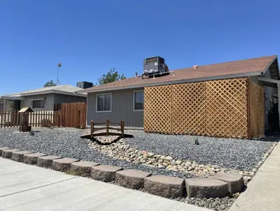 a backyard with a fence and a house at Lovely home central Coalinga-2BR Stopover near I-5 in Coalinga