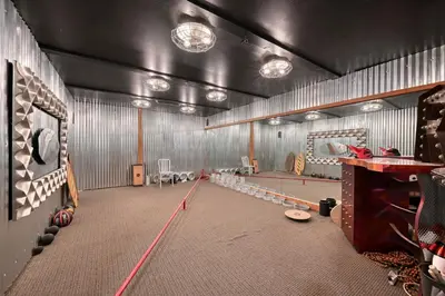 a room with a ping pong table in a gym at Vista De Lago Retreat Luxury Mansion with Pool and Theater in Granite Bay
