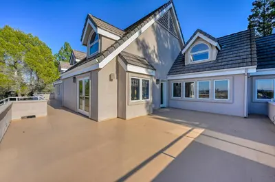 a house with a large driveway in front of it at Vista De Lago Retreat Luxury Mansion with Pool and Theater in Granite Bay