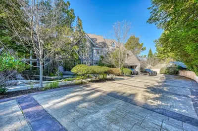 a stone driveway in front of a house at Vista De Lago Retreat Luxury Mansion with Pool and Theater in Granite Bay