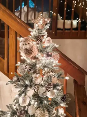 a christmas tree with owls on top of it at Cozy Chic Chalet - Enchanting & Fun Family Retreat - Hot Tub & Fire Pit - Dog Friendly in Dorrington