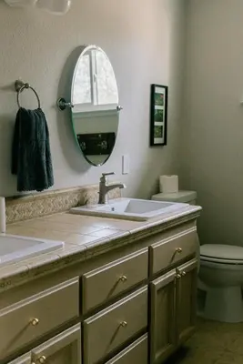 a bathroom with a sink and a toilet and a mirror at Gorgeous 4BR Home Massive Modern Home in Cameron Park
