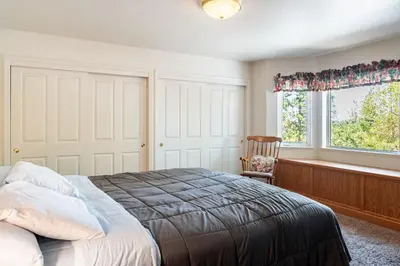 a bedroom with a bed and a window at Groveland 2BR Home - Mountain Retreat in Groveland