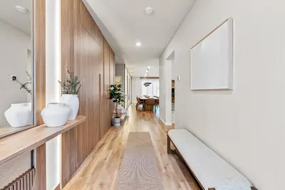a hallway with a bench in a house at NEW 10BD At Windsor Cay Pool and Game Room