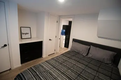 a bedroom with a bed and a refrigerator at Tiny Blue at Yosemite Gateway in Groveland