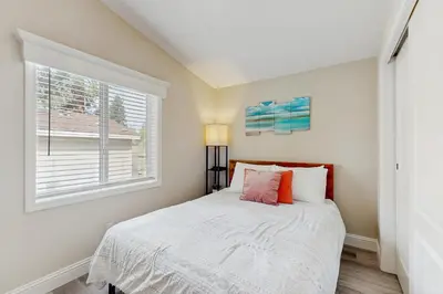 a bedroom with a bed and a window at Sierra Solace in South Lake Tahoe