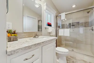 a bathroom with a sink and a toilet and a shower at Sierra Solace in South Lake Tahoe