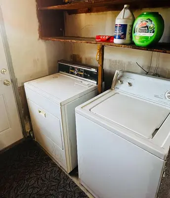 a small kitchen with a white refrigerator and a washer at Fun for 2-Hot Tub-Dogs Ok-Near Bass Lake in Oakhurst