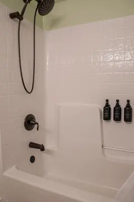 a bathroom with a shower and a bath tub at Buckeye Basecamp-Events-Family Friendly-Creek in Sonora