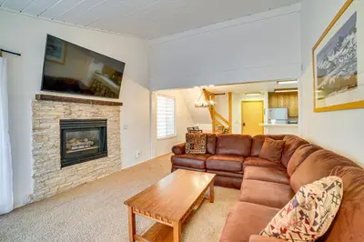 a living room with a couch and a fireplace at St Anton Condo in Mammoth Lakes! in Mammoth Lakes