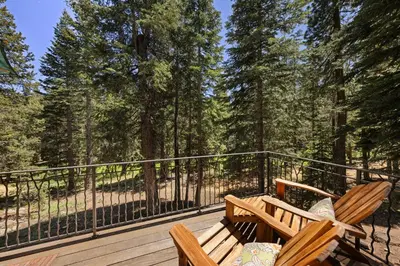 a deck with two wooden benches and a fence at Luxury 4BR Retreat Near Northstar Sleeps 10 in Tahoe Vista