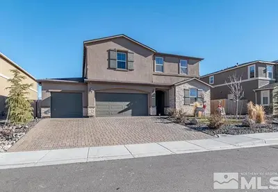 a large house with a driveway in front of it at Peaceful Private Room in Sparks in Sparks