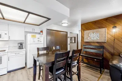 a kitchen and dining room with a table and chairs at La Vista Blanc 19 in Mammoth Lakes